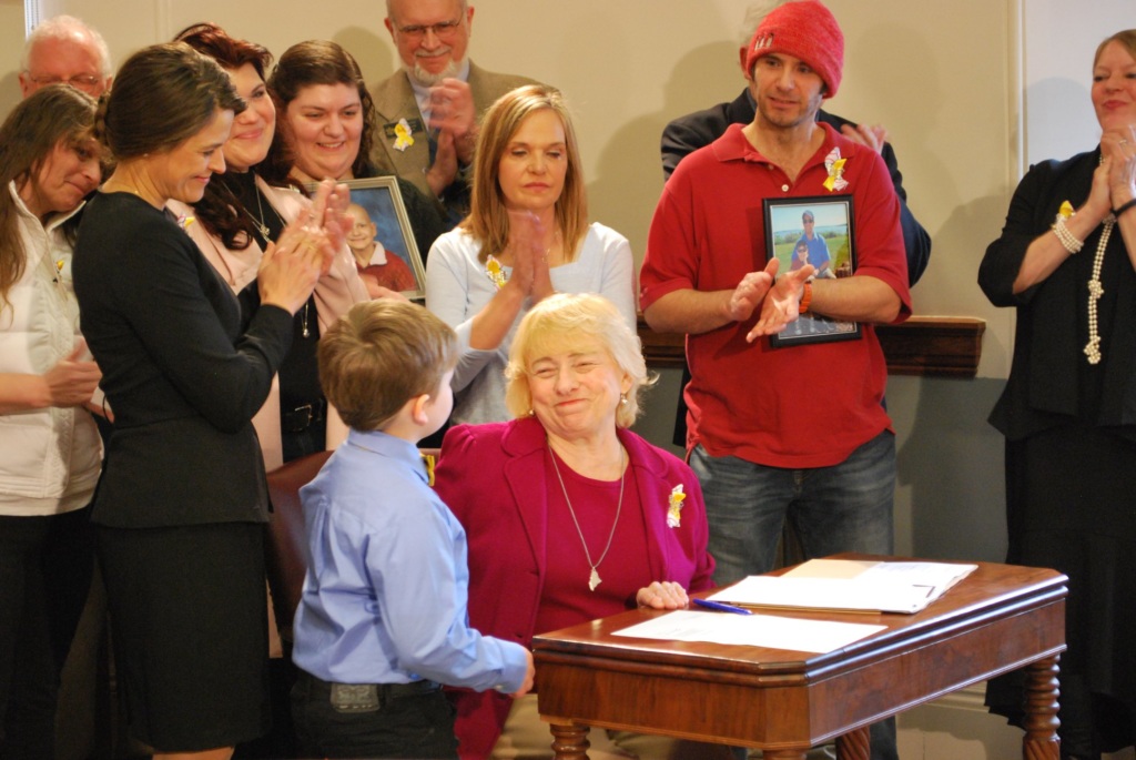 Gov. Janet Mills signs legislation.