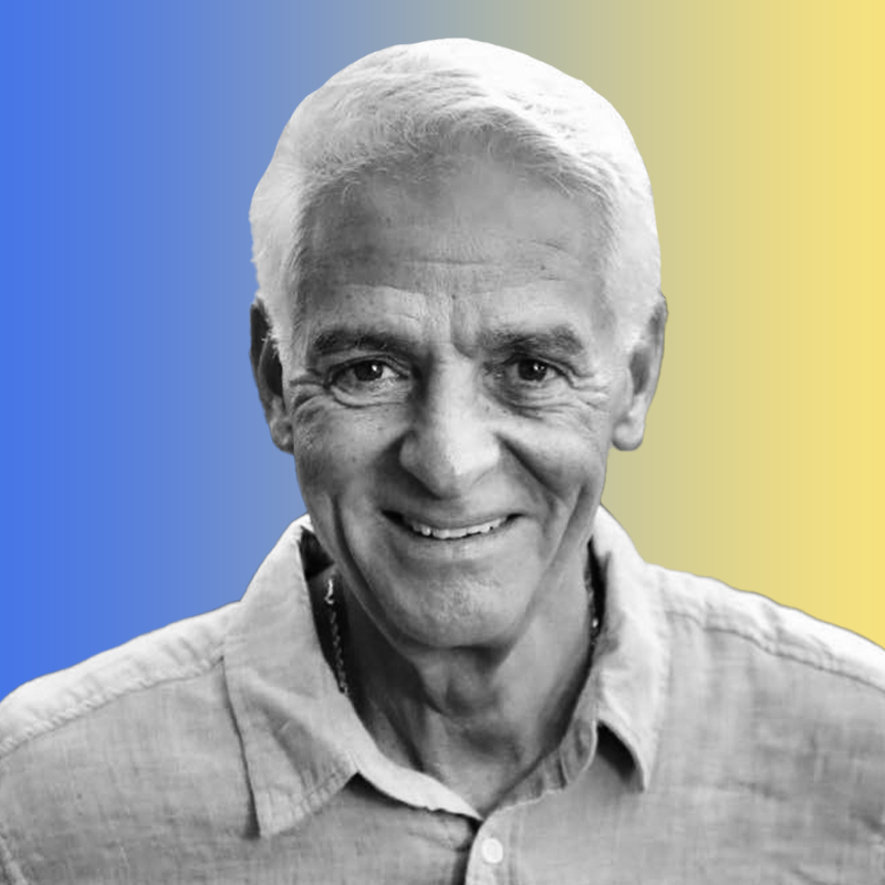 A headshot of Florida Democratic nominee for governor Charlie Crist on a blue-yellow gradient background.
