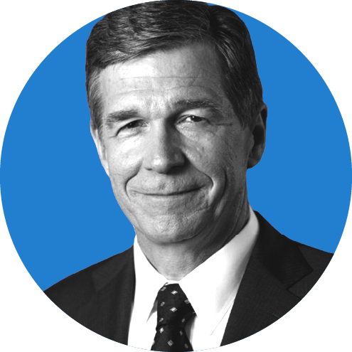 Headshot of North Carolina Governor Roy Cooper on a blue background.